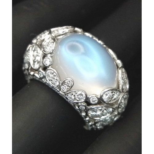 121 - A Ritz of London 18K White Gold, Diamond and Moonstone Dome Dress Ring. An 8ct hypnotising oval cut ... 