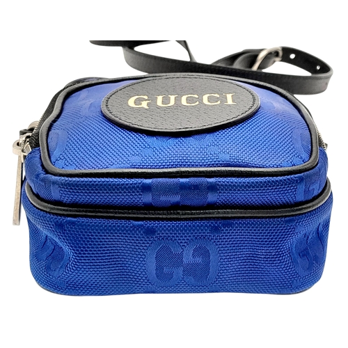 773 - A Gucci Blue GG Nylon Crossbody Bag. Blue GG textile exterior with silver-tone hardware, a front zip... 
