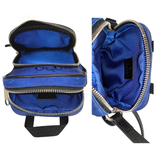 773 - A Gucci Blue GG Nylon Crossbody Bag. Blue GG textile exterior with silver-tone hardware, a front zip... 