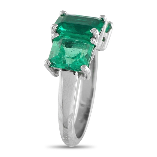 149 - A stunning Platinum 8.0ctw Colombian Emerald Three-Stone Ring. This platinum ring features three Col... 