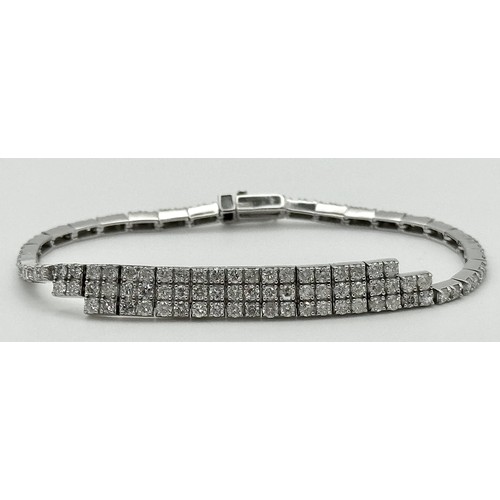 135 - A 14K White Gold Diamond Bracelet. 3.5ctw of round brilliant cut diamonds in a Tetrus-esque design. ... 