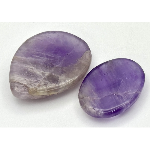 758 - Two Pieces of 86.50ctw Cabochon Amethyst Gemstones. Pear and oval shapes. Ref: V.C.43