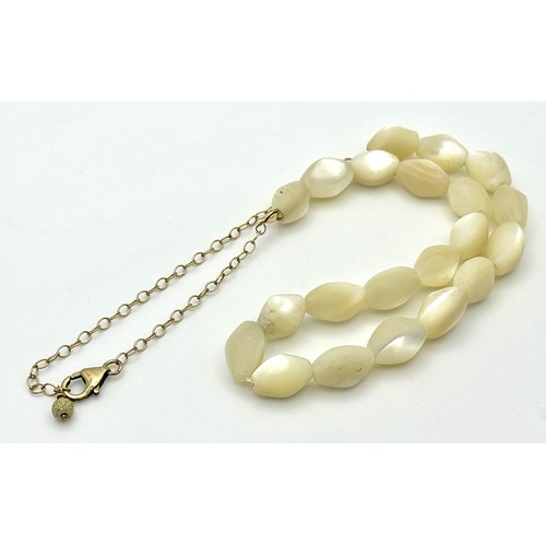 214 - Ivory Coloured Iridescent Beads with a 14K Gold Filled Extender Chain. Comes with a COA. 44cm.