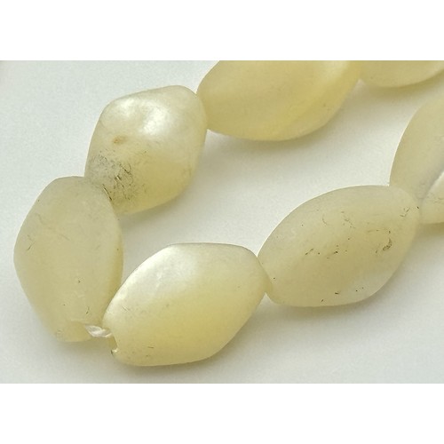 214 - Ivory Coloured Iridescent Beads with a 14K Gold Filled Extender Chain. Comes with a COA. 44cm.