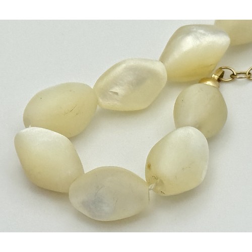 214 - Ivory Coloured Iridescent Beads with a 14K Gold Filled Extender Chain. Comes with a COA. 44cm.