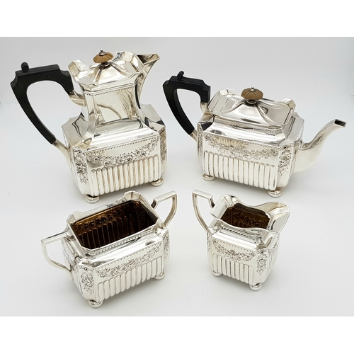 359 - A Wonderful, Antique Victorian Tea and Coffee Sterling Silver Set. A square shaped body set with orn... 