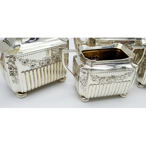 359 - A Wonderful, Antique Victorian Tea and Coffee Sterling Silver Set. A square shaped body set with orn... 