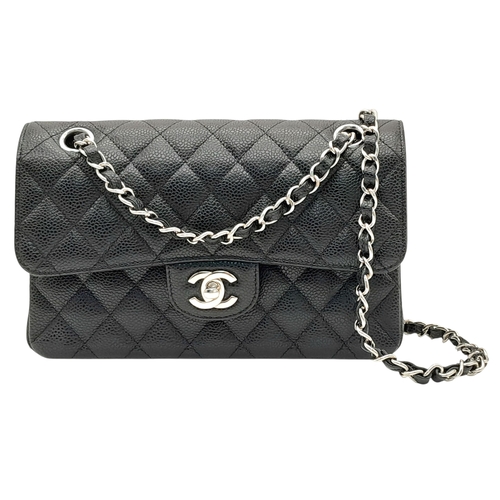 690 - A Chanel Black Caviar Classic Double Flap Bag. Black caviar leather exterior with silver-tone hardwa... 