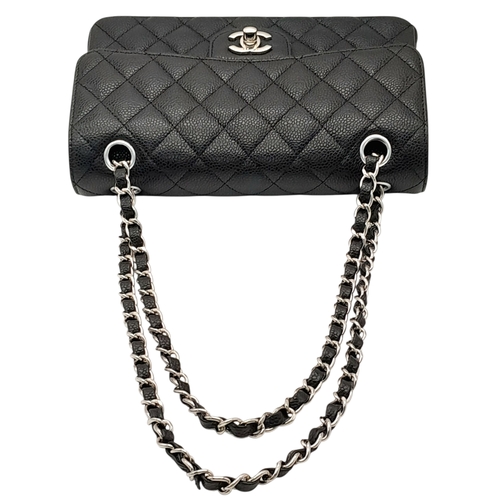 690 - A Chanel Black Caviar Classic Double Flap Bag. Black caviar leather exterior with silver-tone hardwa... 