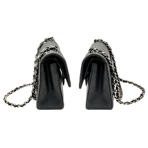 690 - A Chanel Black Caviar Classic Double Flap Bag. Black caviar leather exterior with silver-tone hardwa... 