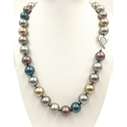 12 - A Multi-Colour South Sea Shell Pearl Necklace. 14mm beads. 42cm necklace length.