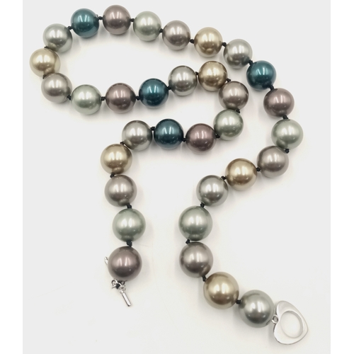 12 - A Multi-Colour South Sea Shell Pearl Necklace. 14mm beads. 42cm necklace length.