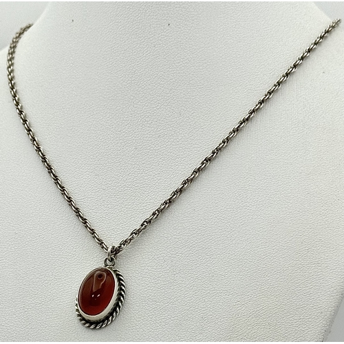 4 - A Sterling Silver and Carnelian Pendant on a 925 Silver Chain. 2cm and 44cm. 7.75g.