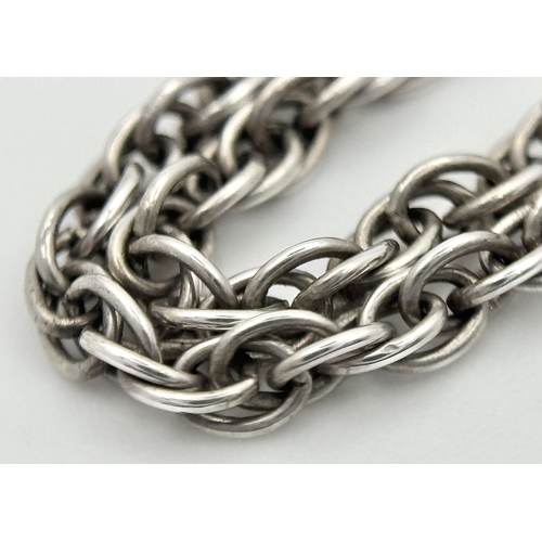 4 - A Sterling Silver and Carnelian Pendant on a 925 Silver Chain. 2cm and 44cm. 7.75g.