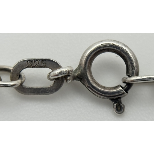 4 - A Sterling Silver and Carnelian Pendant on a 925 Silver Chain. 2cm and 44cm. 7.75g.