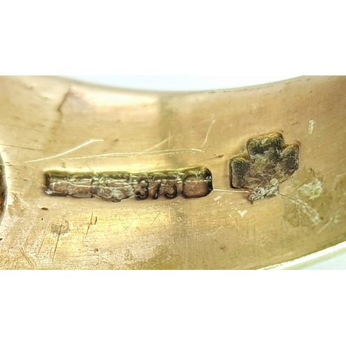 1 - A GENTS 9K GOLD RING WITH DISTINCTIVE PIERCED DESIGN.      6.9gms    size O