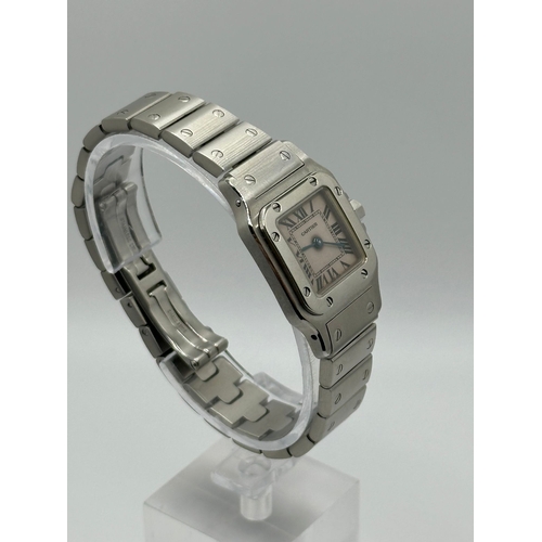 101 - A Cartier 1565 Stainless Steel Santos Watch, 24mm case white dial and Roman numerals. Year 2009, com... 