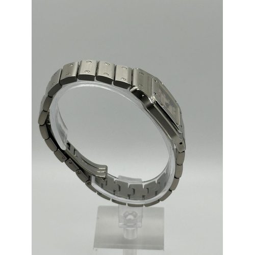 101 - A Cartier 1565 Stainless Steel Santos Watch, 24mm case white dial and Roman numerals. Year 2009, com... 