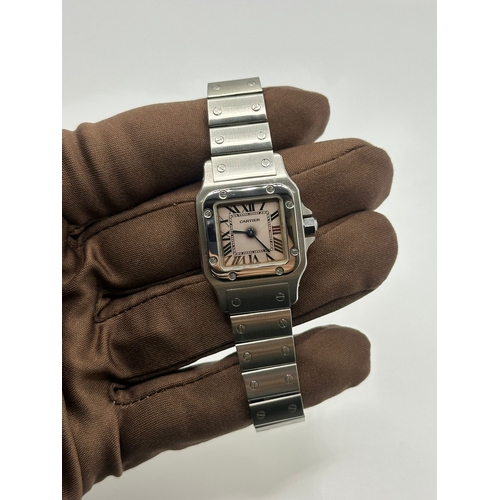 101 - A Cartier 1565 Stainless Steel Santos Watch, 24mm case white dial and Roman numerals. Year 2009, com... 