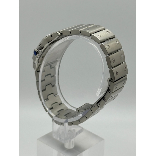 101 - A Cartier 1565 Stainless Steel Santos Watch, 24mm case white dial and Roman numerals. Year 2009, com... 