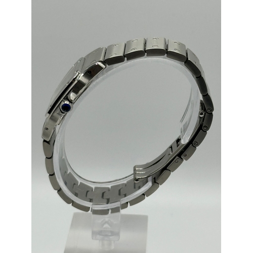 101 - A Cartier 1565 Stainless Steel Santos Watch, 24mm case white dial and Roman numerals. Year 2009, com... 