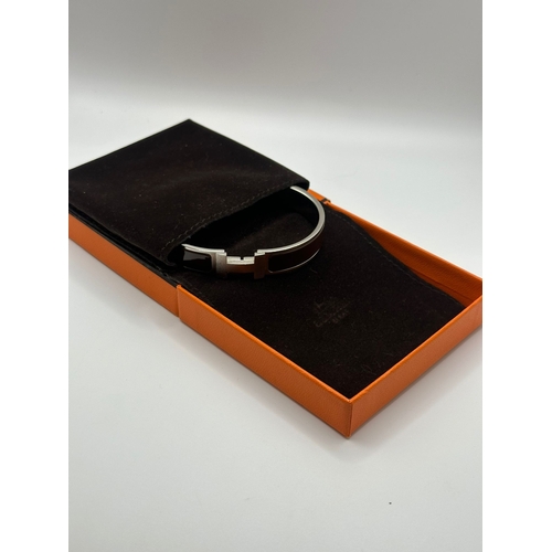 115 - A Hermes Click HH Bracelet Brushed Palladium & Brown Enamel Bangle. Comes with Box & Jewellery Bag (... 