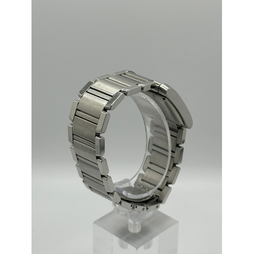 72 - A Cartier 2302  Stainless Steel Tank Watch. Year 2009, 28mm case with date box, comes with papers. I... 