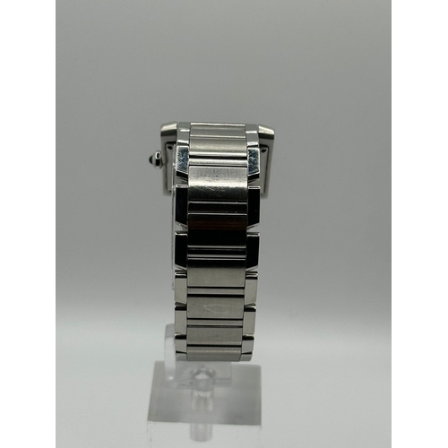 72 - A Cartier 2302  Stainless Steel Tank Watch. Year 2009, 28mm case with date box, comes with papers. I... 