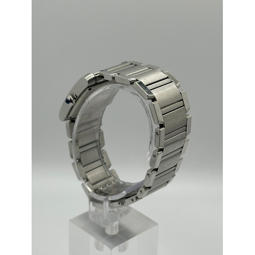 72 - A Cartier 2302  Stainless Steel Tank Watch. Year 2009, 28mm case with date box, comes with papers. I... 