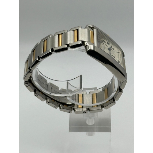 79 - A Cartier 2303 Tank Francaise Watch. Bi metal (18k yellow gold and stainless steel) strap. Year 2007... 