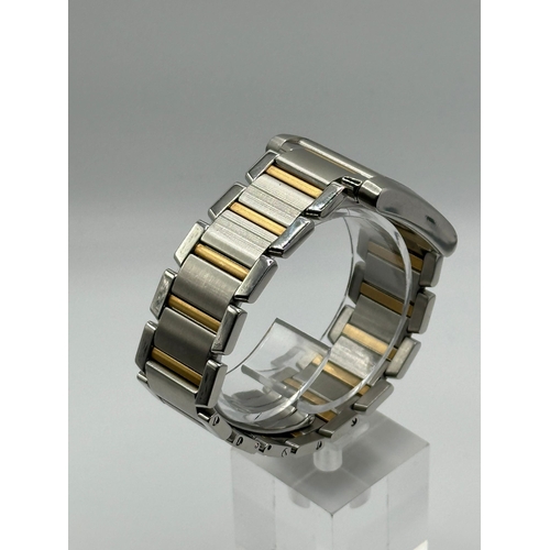 79 - A Cartier 2303 Tank Francaise Watch. Bi metal (18k yellow gold and stainless steel) strap. Year 2007... 