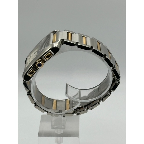 79 - A Cartier 2303 Tank Francaise Watch. Bi metal (18k yellow gold and stainless steel) strap. Year 2007... 