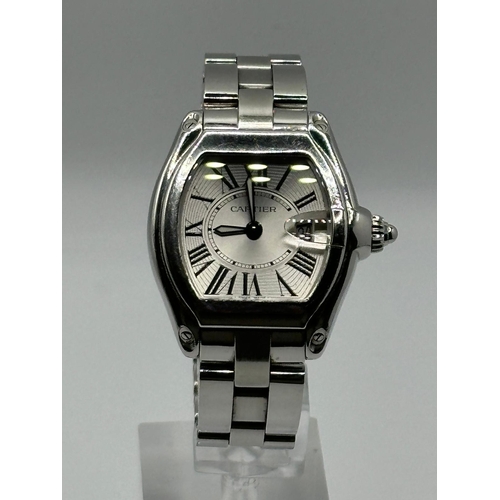 93 - A Cartier 2675 Stainless Steel Roadster watch. 33mm case, white dial with Roman numerals, year 2005.... 