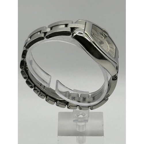 93 - A Cartier 2675 Stainless Steel Roadster watch. 33mm case, white dial with Roman numerals, year 2005.... 