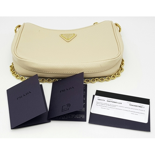 104 - A Prada Mini Re-Edition Saffiano Cream Leather Handbag. Gold-tone hardware. Comes with a certificate... 