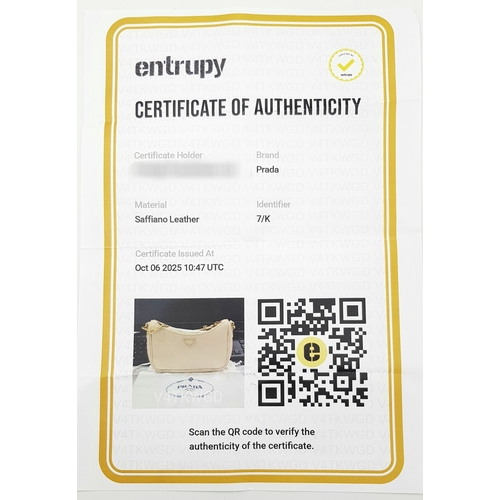 104 - A Prada Mini Re-Edition Saffiano Cream Leather Handbag. Gold-tone hardware. Comes with a certificate... 