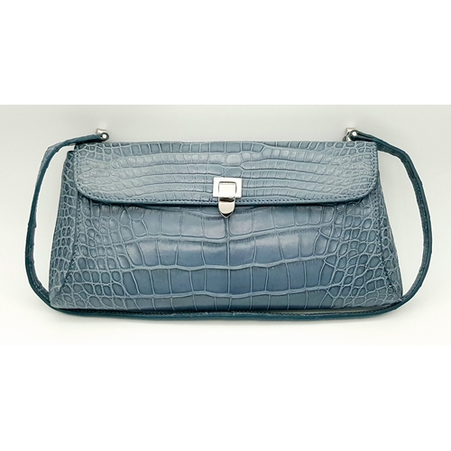 90 - An Asprey Blue Alligator Leather Handbag. Silver toned hardware. Shoulder strap. Blue leather interi... 