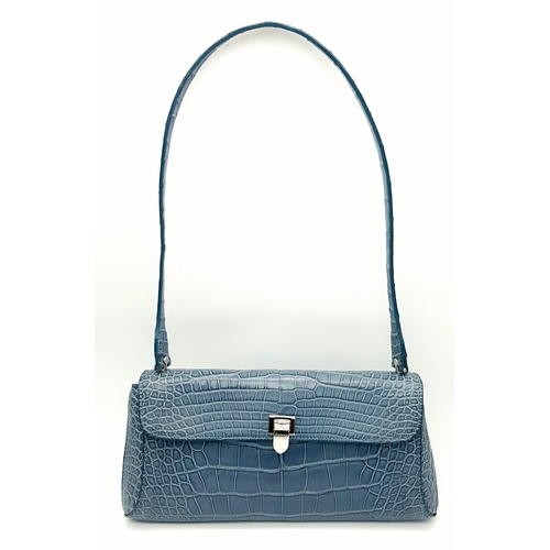 90 - An Asprey Blue Alligator Leather Handbag. Silver toned hardware. Shoulder strap. Blue leather interi... 