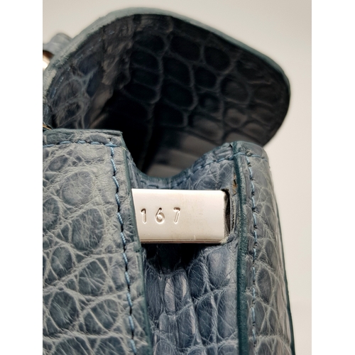 90 - An Asprey Blue Alligator Leather Handbag. Silver toned hardware. Shoulder strap. Blue leather interi... 