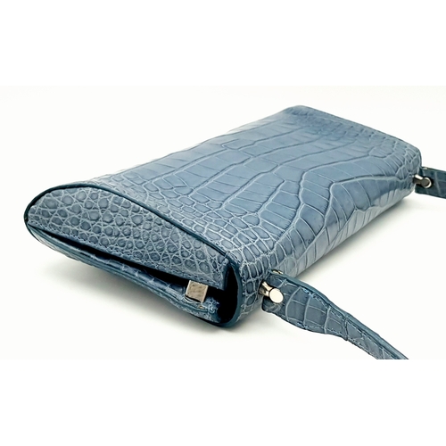 90 - An Asprey Blue Alligator Leather Handbag. Silver toned hardware. Shoulder strap. Blue leather interi... 