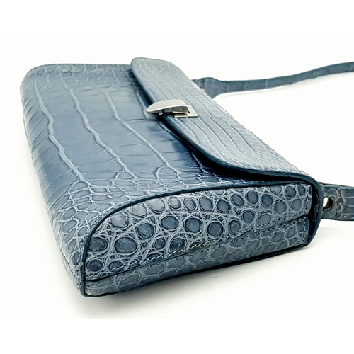 90 - An Asprey Blue Alligator Leather Handbag. Silver toned hardware. Shoulder strap. Blue leather interi... 