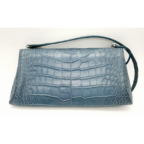 90 - An Asprey Blue Alligator Leather Handbag. Silver toned hardware. Shoulder strap. Blue leather interi... 
