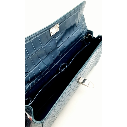 90 - An Asprey Blue Alligator Leather Handbag. Silver toned hardware. Shoulder strap. Blue leather interi... 