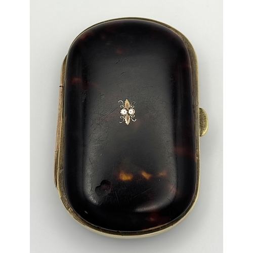 86 - An Antique (possibly French) Faux Tortoiseshell Small Purse. 
Silk interior is in fair condition for... 