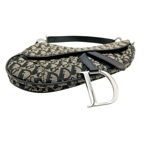 83 - A Christian Dior Saddle Canvas Bag. Black and cream  exterior with Dior monogram decoration througho... 
