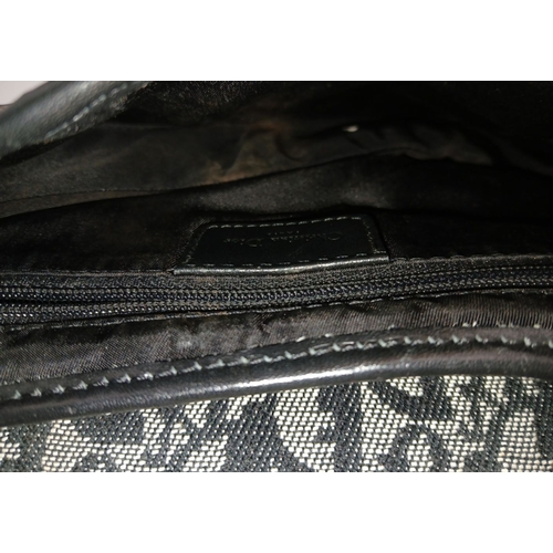 83 - A Christian Dior Saddle Canvas Bag. Black and cream  exterior with Dior monogram decoration througho... 