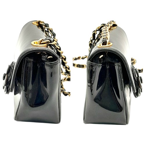 69 - A Chanel Camellia Flap Bag in Black Patent Leather. Exterior open pocket. Gold tone hardware. Classi... 