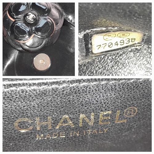 69 - A Chanel Camellia Flap Bag in Black Patent Leather. Exterior open pocket. Gold tone hardware. Classi... 