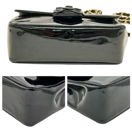 69 - A Chanel Camellia Flap Bag in Black Patent Leather. Exterior open pocket. Gold tone hardware. Classi... 