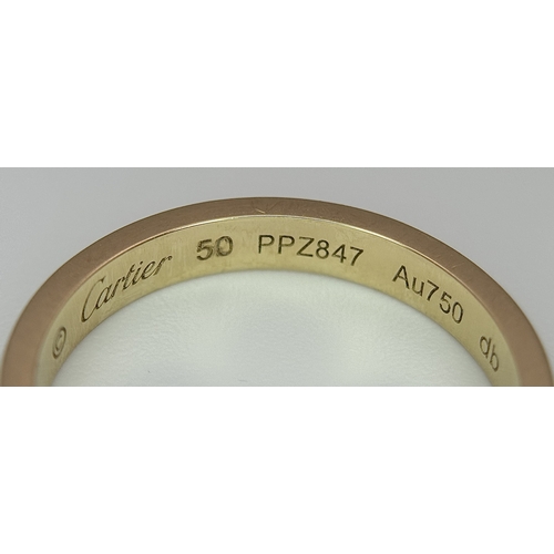 29 - An 18K Gold and Diamond Pave Cartier Love Band Ring. 4mm width. Size 50. 2.1g. Comes with a Cartier ... 